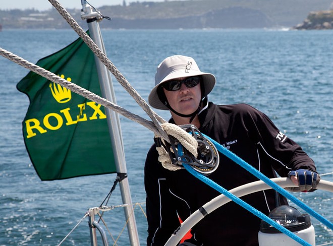 Bryan Bailie behind the helm of the VO60, Merit. - Rolex Sydney Hobart Yacht Race ©  Alex McKinnon Photography http://www.alexmckinnonphotography.com